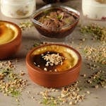 Delicious traditional Turkish sütlaç topped with nuts, perfect for dessert lovers.